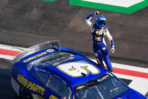 NASCAR Cup Series driver Chase Elliott (9) celebrates after winning a NASCAR Cup Series auto race at Atlanta Motor Speedway, Sunday, July 10, 2022, in Hampton, Ga. (AP Photo/Bob Andres)