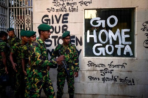 Sri Lanka army soldiers patrol near the official residence of president Gotabaya Rajapaksa three days after it was stormed by anti government protesters in Colombo in Colombo, Sri Lanka, Tuesday, July 12, 2022. A political vacuum continues in Sri Lanka with opposition leaders yet to agree on who should replace its roundly rejected leaders, whose residences are occupied by protesters angry over the country's deep economic woes. (AP Photo/Rafiq Maqbool)