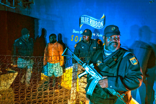 Police patrol an area in Soweto, South Africa Tuesday, July 12, 2022 in search of illegal firearms following the weekend shooting in a bar which claimed 16 people. South African police are searching for illegally-held guns in patrols of Johannesburg's Soweto township, following a spate of bar shootings that have rocked the nation. (AP Photo/Shiraaz Mohamed)