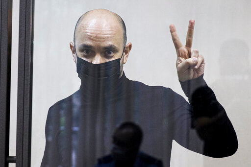 FILE - Andrei Pivovarov, head of the Open Russia movement, gestures during a court session in Krasnodar, Russia, Wednesday, June 2, 2021. Andrei Pivovarov, former head of the Open Russia group, was sentenced to four years in prison for &quot;directing an undesirable organization,&quot; a criminal offense under a 2015 law. He has maintained his innocence and has insisted that the charges against him were brought because of his plans to run for parliament in September 2021. (AP Photo, File)