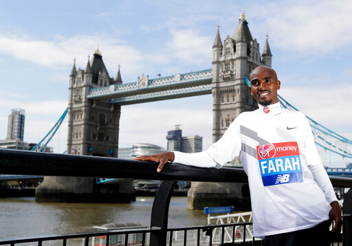 FILE - Britain's Mo Farah poses for the media at a photocall near Tower Bridge in London, Tuesday, April 17, 2018. It is hard to be first. Mo Farah this week went from being a gold medal-winning runner to the most prominent person ever to come forward as a victim of people trafficking. The four-time Olympic champion&rsquo;s decision to tell the story of how he was exploited as a child gives a face to the often faceless victims of modern slavery, highlighting a crime that is often conflated with illegal immigration. (AP Photo/Kirsty Wigglesworth, FILE)