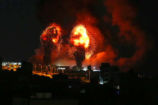 Sparks from an explosion caused by Israeli airstrikes in Gaza City, Saturday, July 16, 2022. (AP Photo/Mohammed Ali)