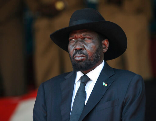 FILE - South Sudan's President Salva Kiir attends the state funeral of Kenya's former president Daniel arap Moi, at Nyayo Stadium in the capital Nairobi, Kenya, Feb. 11, 2020.An explosion of violence in South Sudan is raising fears that the country's fragile peace agreement could unravel before the transitional government wraps up early next year. (AP Photo/John Muchucha, File)