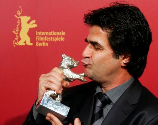FILE - Iranian director Jafar Panahi poses with his Silver Berlin Bear award at the 56th Berlinale International Film Festival in Berlin, Feb. 18, 2006. Iran's judiciary on Tuesday, July 19, 2022, ordered Panahi, perhaps Iran's best-known film director, to serve out a six-year prison sentence from a decade ago that had never been enforced, as the government seeks to silence criticism amid growing economic turmoil and political pressure. Iranian Judiciary Spokesman Masoud Setayeshi made the announcement on charges of producing anti-government propaganda, a final verdict that he said should have been implemented at the time. (AP Photo/Arnd Wiegmann, Pool, File)