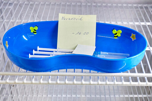 FILE - A kidney dish with syringes containing the Novavax COVID-19 vaccine sits in a refrigerator ready for use at a vaccination center in Prisdorf, Germany, Saturday, Feb. 26, 2022. On Tuesday, July 19, 2022, a U.S. Centers for Disease Control and Prevention advisory panel recommended the shots and final action will come from the agency's director. (Georg Wendt/dpa via AP, File)