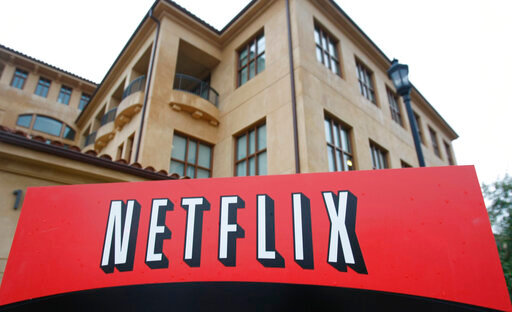 FILE - This photo shows the company logo and view of Netflix headquarters in Los Gatos, Calif., Jan. 29, 2010. Netflix shed almost 1 million subscribers during the spring amid tougher competition and soaring inflation that&rsquo;s squeezing household budgets, heightening the urgency behind the video streaming service&rsquo;s effort to launch a cheaper option with commercial interruptions. The April-June contraction of 970,000 accounts, announced Tuesday, July 19, 2022, as part of Netflix&rsquo;s second-quarter earnings report, is by far the largest quarterly subscriber loss in the company&rsquo;s 25-year history. (AP Photo/Marcio Jose Sanchez, File)