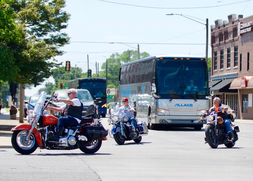 A pair of buses full of Kansas Shrine Bowl players arrive in downtown Pittsburg on Wednesday. The buses were escorted by the Pittsburg Police Department and a fleet of bikers as they made their way to the campus of Pittsburg State University.