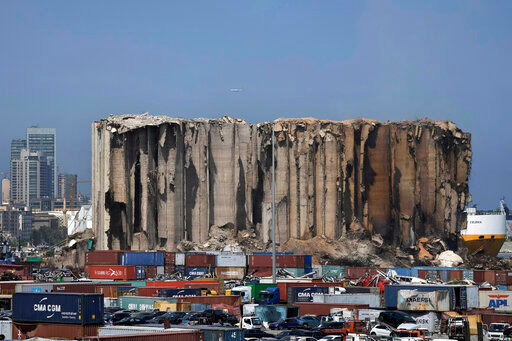General view of grain silos at Beirut port, Lebanon, Friday, July 22, 2022. The latest fire at the silos&rsquo; damaged north block, right part, was due to fermenting wheat and grains still trapped inside the building, outgoing Economy Minister Amin Salam told reporters. On Aug. 4, 2020, hundreds of tons of ammonium nitrate, a highly explosive material used in fertilizers that had been improperly stored for years in the giant silos exploded. (AP Photo/Hassan Ammar)
