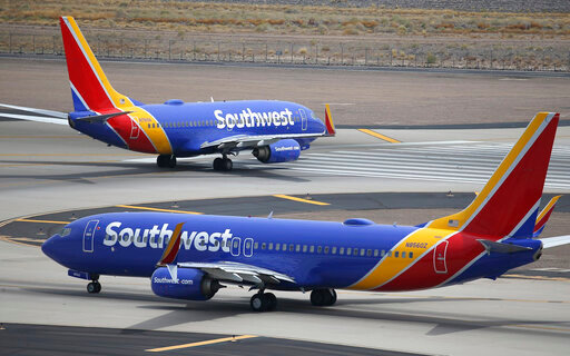 FILE - Southwest Airlines planes at Phoenix Sky Harbor International Airport in Phoenix, July 17, 2019. Federal officials say that Southwest Airlines and the union representing its pilots have resisted cooperating with investigations into accidents and other incidents and pushed to close the matters quickly. In one instance disclosed Wednesday, July 27, 2022, the Federal Aviation Administration cut short an investigation of a 2019 incident in Connecticut even though the agency determined that there was pilot error. (AP Photo/Ross D. Franklin, File)