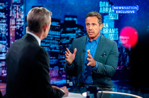 In this image provided by NewsNation, Chris Cuomo answers questions during an interview with Dan Abrams, Tuesday, July 26, 2022, in New York. Cuomo is publicly reemerging following his firing from CNN, starting a YouTube news show and joining NewsNation's lineup in the fall. (NewsNation via AP)