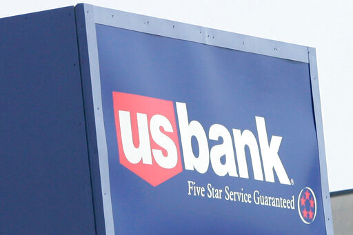 FILE - The logo of Minnesota-based US Bank is shown at the Bloomington, Minn., branch, Monday, July 16, 2007. For more than a decade, US Bank pressured its employees to open fake accounts in their customers' names in order to meet unrealistic sales goals, the Consumer Financial Protection Bureau said Thursday, July 28, 2022, in a case that is deeply similar to the sales practices scandal uncovered at Wells Fargo last decade. (AP Photo/Jim Mone, File)
