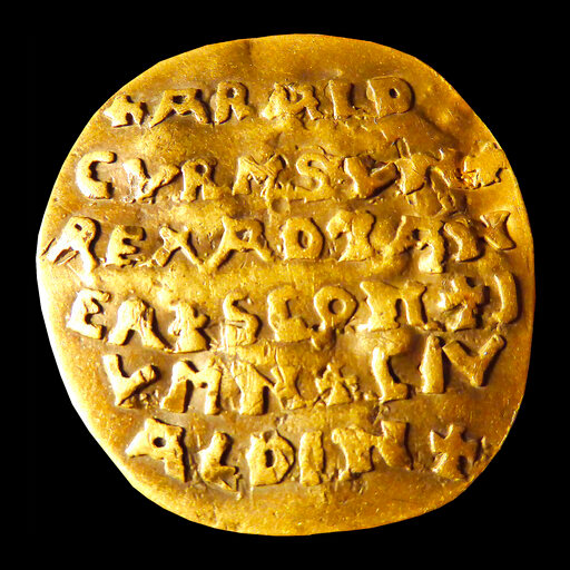 The 10th century golden Curmsun disc with the name of Danish King Harald &ldquo;Bluetooth&ldquo; Gormsson (Curmsun in Latin) on it, coming from a tomb at the Roman Catholic church in Wiejkowo, Poland, photographed in Malmo, Sweden, in 2015. The Bluetooth wireless link technology is named after the king. More than 1,000 years after his death in what is now Poland, a Danish king whose nickname is known to the world through the Bluetooth technology is at the center of an archeological dispute. (Sven Rosborn via AP)