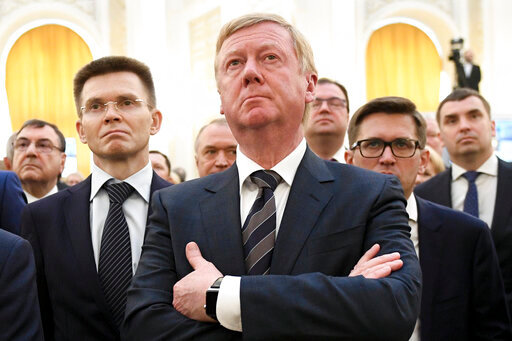 FILE - Rosnano Chairman Anatoly Chubais, center, attends the inauguration of Russian President Vladimir Putin in the Kremlin's Grand Kremlin Palace in Moscow, Russia, Monday, May 7, 2018. Chubais, who resigned as a high-ranking adviser to Russian President Vladimir Putin and left Russia shortly after the invasion of Ukraine, was reported to be in intensive care in a European hospital for a neurological disorder, a Russian television personality and family friend of Chubais, said Sunday, July 31, 2022. (Alexei Nikolsky, Sputnik, Kremlin Pool Photo via AP, File)