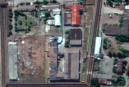 In this satellite photo provided by Maxar Technologies, a view of the Olenivka detention center, in Eastern Donetsk province, after an attack on the prison reportedly killed Ukrainian soldiers captured in May after the fall of Mariupol, a Black Sea port city where troops and the Azov Regiment of the national guard famously held out against a months-long Russian siege. Separatist authorities and Russian officials said the attack killed 53 Ukrainian POWs and wounded another 75.  (Satellite image &copy;2022 Maxar Technologies via AP)
