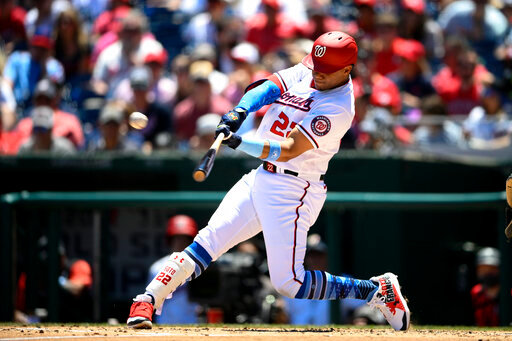 FILE - Washington Nationals' Juan Soto hits a three-run home run during the second inning of a baseball game against the Philadelphia Phillies, on June 19, 2022, in Washington. The San Diego Padres acquired superstar outfielder Juan Soto from the Nationals on Tuesday, Aug. 2, 2022, in one of baseball's biggest deals at the trade deadline, vaulting their postseason chances by adding one of the game's best young hitters.  (AP Photo/Nick Wass, File)