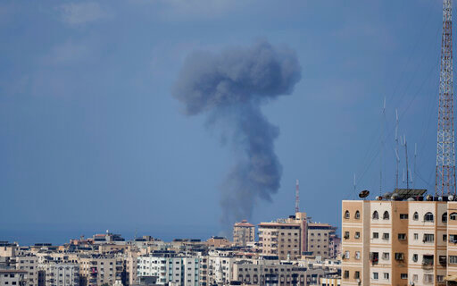Smoke rises following Israeli airstrikes on a building in Gaza City, Saturday, Aug. 6, 2022. (AP Photo/Hatem Moussa)
