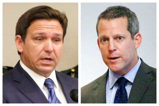 This combination of Thursday, Aug. 4, 2022 photos shows Florida Gov. Ron DeSantis, left, and Hillsborough County State Attorney Andrew Warren during separate news conferences in Tampa, Fla. On Sunday, Aug. 7, 2022, Warren vowed to fight his suspension from office by DeSantis over his promise not to enforce the state's 15-week abortion ban and support for gender transition treatments for minors. (Douglas R. Clifford/Tampa Bay Times via AP)