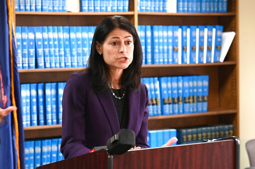 FILE - Attorney General Dana Nessel speaks during a news conference in Detroit, Thursday, Oct. 14, 2021. Published reports say Nessel&rsquo;s office is asking that a special prosecutor investigate whether the Republican candidate for state attorney general, Matt DePerno, and others should be charged in connection with an effort to gain access to voting machines after the 2020 election. DePerno has been endorsed by former President Donald Trump. (Max Ortiz/Detroit News via AP, File)
