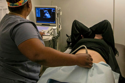 FILE - An operating room technician performs an ultrasound on a patient at an abortion clinic in Shreveport, La., Wednesday, July 6, 2022. Serious pregnancy complications are rare in the United States but they still affect thousands of women each year. (AP Photo/Ted Jackson, File)