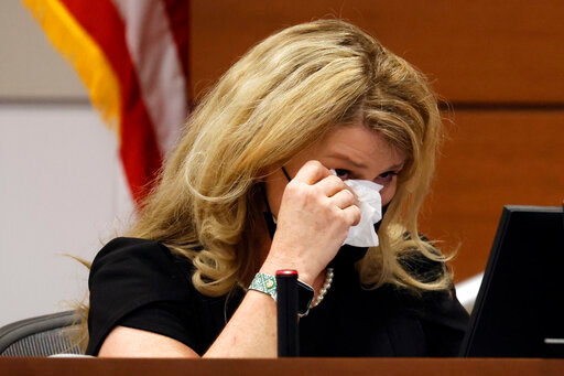 Patricia &quot;Trish&quot; Devaney Westerlind becomes emotional as she testifies during the penalty phase of the trial of Marjory Stoneman Douglas High School shooter Nikolas Cruz at the Broward County Courthouse in Fort Lauderdale, Fla., Tuesday, Aug. 23, 2022. Devaney Westerlind lived in Parkland from 1998 to 2008 and was a neighbor of the Cruz family. Cruz previously plead guilty to all 17 counts of premeditated murder and 17 counts of attempted murder in the 2018 shootings. (Amy Beth Bennett/South Florida Sun Sentinel via AP, Pool)