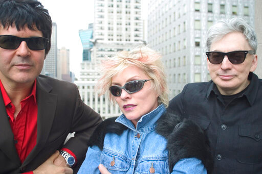 FILE - Clem Burke, from left, Deborah Harry and Chris Stein, members of the rock group Blondie, pose for a photo in New York, on April 8, 2004. The band is releasing a box set  &ldquo;Blondie: Against the Odds, 1974-1982,&rdquo; with 124 tracks and 36 previously unissued recordings, demos, outtakes and Blondie&rsquo;s initial six studio albums. (AP Photo/Justin Walters, File)
