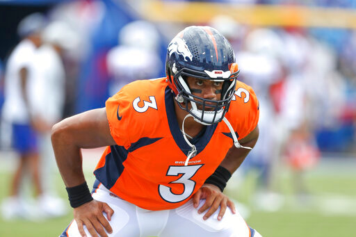 Denver Broncos quarterback Russell Wilson warm-up before a preseason NFL football game against the Buffalo Bills, Saturday, Aug. 20, 2022, in Orchard Park, N.Y. (AP Photo/Joshua Bessex)