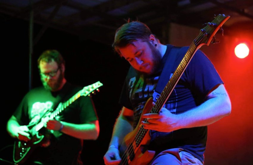 Jared Chastain, left, and Alex Moore of the band Flowsion play at the first End of Summer Bash in Cherryvale in 2016.