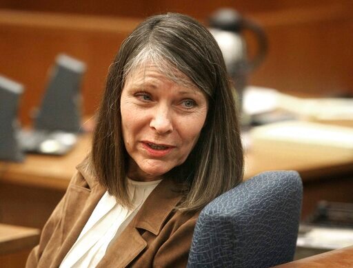 FILE - Dana Chandler is seen in court before opening arguments, Thursday, March 8, 2012, in Topeka, Kan. Chandler, a Topeka woman, was charged with two counts of premeditated first-degree murder in the July 7, 2002, slayings of her ex-husband, 47-year-old Mike Sisco, and 53-year-old Karen Harkness. Her convictions for killing the couple 20 years ago were overturned because of prosecutorial misconduct, but she is now back before jurors in Kansas, still maintaining she was miles away in Colorado when the deaths occurred. (Thad Allton/The Topeka Capital-Journal via AP, File)