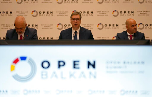 Serbian President Aleksandar Vucic, center, speaks during the &quot;Open Balkan&quot; economic forum for regional cooperation in Belgrade, Serbia, Friday, Sept. 2, 2022. (AP Photo/Darko Vojinovic)