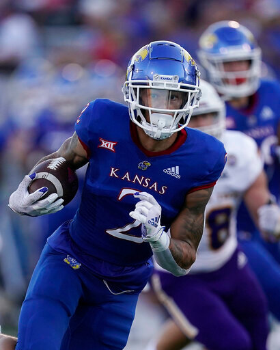 Kansas wide receiver Lawrence Arnold runs the ball during the first half of an NCAA college football game against Tennessee Tech Friday, Sept. 2, 2022, in Lawrence, Kan. (AP Photo/Charlie Riedel)