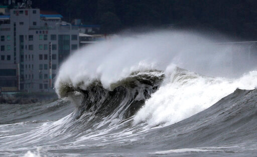 High waves crash onto a beach in Busan, South Korea, as Typhoon Hinnamnor approaches the Korean Peninsula on Monday, Sept. 5, 2022. Hundreds of flights were grounded and more than 200 people evacuated in South Korea on Monday as Typhoon Hinnamnor approached the southern region with heavy rains and winds of up to 170 kilometers (105 miles) per hour, putting the nation on alert for its worst storm in decades. (Son Hyung-joo/Yonhap via AP)