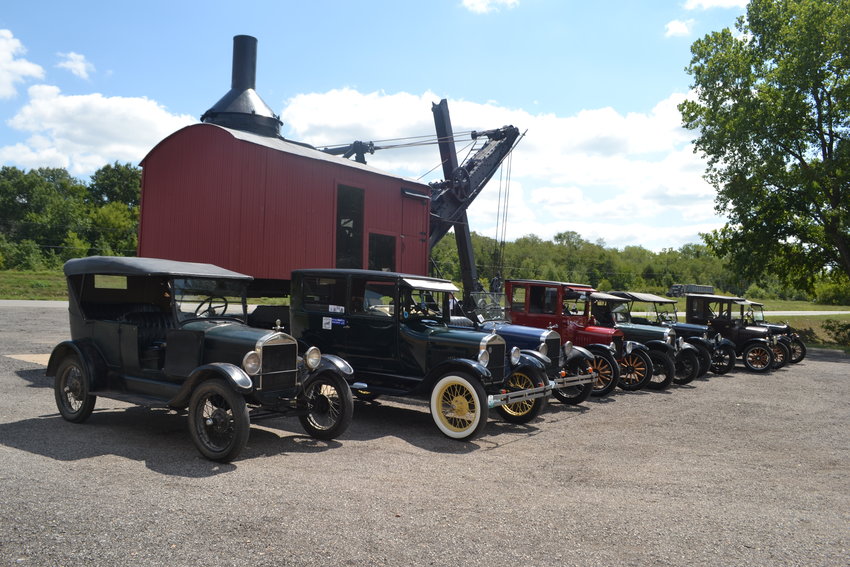 100 years of history: a line of Model T Fords in front of the steam shovel at the Crawford County Historical Museum.