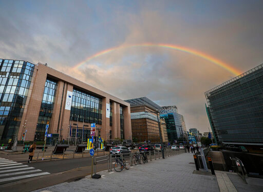 A rainbow forms between the European Council building, left, and the European Commission building right outside a meeting of EU energy ministers in Brussels, Friday, Sept. 9, 2022. European Union energy ministers are holding an emergency meeting Friday to discuss the bloc's electricity market. (AP Photo/Olivier Matthys)