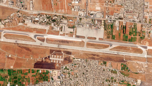 This satellite photo from Planet Labs PBC shows the damage after an Israeli strike targeting the Aleppo International Airport in Aleppo, Syria, Wednesday, Sept. 7, 2022. An Israeli strike on a Syrian airport tore large craters in three spots on the facility's runway, again closing the airfield after a strike days earlier also halted traffic, satellite images analyzed Thursday by The Associated Press show. (Planet Labs PBC via AP)