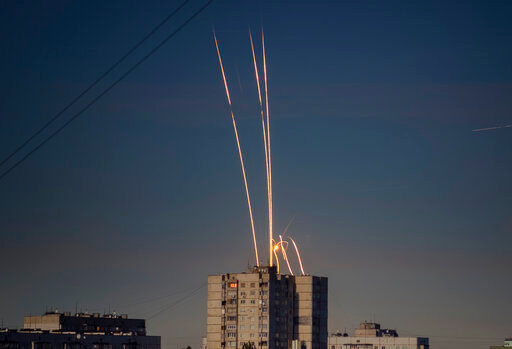 Russian rockets launched against Ukraine from Russia's Belgorod region are seen at dawn in Kharkiv, Ukraine, early Friday, Sept. 9, 2022. (AP Photo/Vadim Belikov)