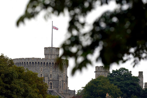 The British flag flies at half mast at Windsor Castle, Berkshire, following Thursday's death of Queen Elizabeth II, Friday Sept. 9, 2022. Queen Elizabeth II, Britain's longest-reigning monarch and a rock of stability across much of a turbulent century, died Thursday at the age of 96 after 70 years on the throne.  (John Walton/PA Wire/PA via AP)