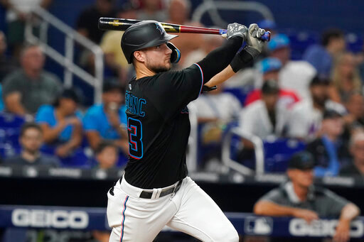 Miami Marlins' Charles Leblanc (83) hits a two-run home run in the eighth inning of a baseball game against the New York Mets, Friday, Sept. 9, 2022, in Miami. The Marlins defeated the Mets 6-3. (AP Photo/Marta Lavandier)
