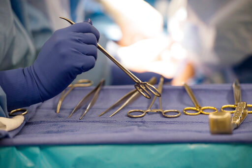 FILE - Surgical instruments are used during an organ transplant surgery at a hospital in Washington on Tuesday, June 28, 2016. The U.S. counted its millionth organ transplant on Friday, Sept. 9, 2022, a milestone that comes at a critical time for Americans still desperately waiting for that chance at survival. (AP Photo/Molly Riley)