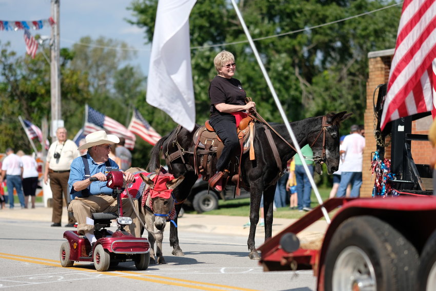 Area residents and their animals march in the 2019 Weir Homecoming parade.