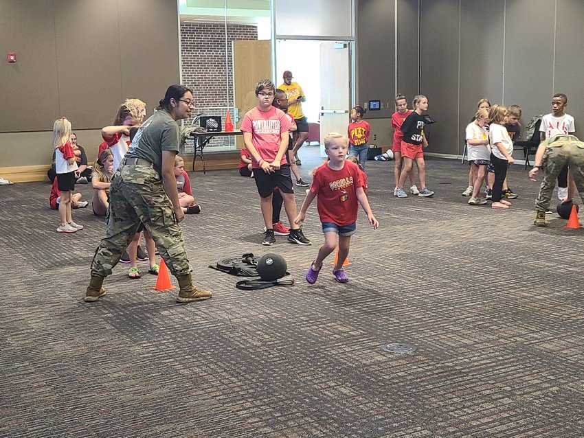Children participate in an exercise course led by Pittsburg State University&rsquo;s ROTC as one of the activities for PSU&rsquo;s long-time tradition, Family Day, on Saturday. Besides the exercise course, other activities for the children and families included science experiments featuring the Nutty Professor, and learning about raptor birds by seeing them up close.