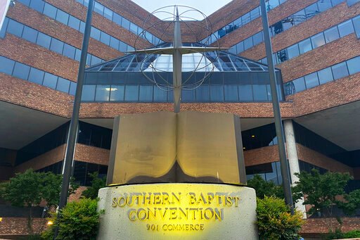 FILE - A cross and Bible sculpture stand outside the Southern Baptist Convention headquarters in Nashville, Tenn., May 24, 2022. On Tuesday, Sept. 20, 2022, the Southern Baptists' top administrative body voted to cut ties with two congregations: an LGBTQ-friendly church in North Carolina that had itself quit the denomination decades earlier and a New Jersey congregation it cited for &ldquo;alleged discriminatory behavior.&rdquo; (AP Photo/Holly Meyer, File)