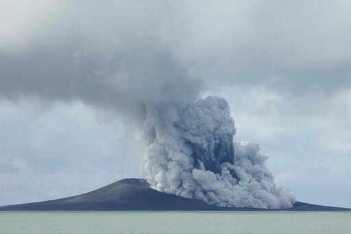 FILE - In this photo provided by New Zealand's Ministry of Foreign Affairs and Trade, the Hunga Tonga-Hunga Ha&rsquo;apai volcano erupts near Tonga in the South Pacific Ocean on Jan. 14, 2015. The volcano shot millions of tons of water vapor high up into the atmosphere according to a study published Thursday, Sept. 22, 2022, in the journal Science. Researchers estimate the event raised the amount of water in the stratosphere - the second layer of the atmosphere, above the range where humans live and breathe - by around 5%. (AP Photo/New Zealand's Ministry of Foreign Affairs and Trade)