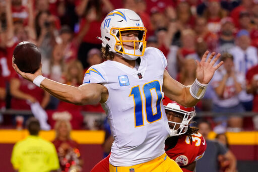 Los Angeles Chargers quarterback Justin Herbert throws during the second half of an NFL football game against the Kansas City Chiefs Thursday, Sept. 15, 2022, in Kansas City, Mo. (AP Photo/Ed Zurga)