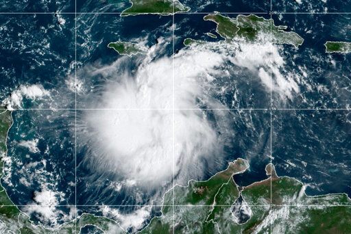 This satellite image provided by the National Oceanic and Atmospheric Administration shows Tropical Storm Ian over the central Caribbean on Saturday, Sept. 24, 2022.  (NOAA via AP)