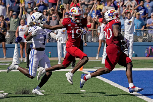 Kansas running back Daniel Hishaw Jr. (20) scores a touchdown during the first half of an NCAA college football game against Duke Saturday, Sept. 24, 2022, in Lawrence, Kan. (AP Photo/Charlie Riedel)