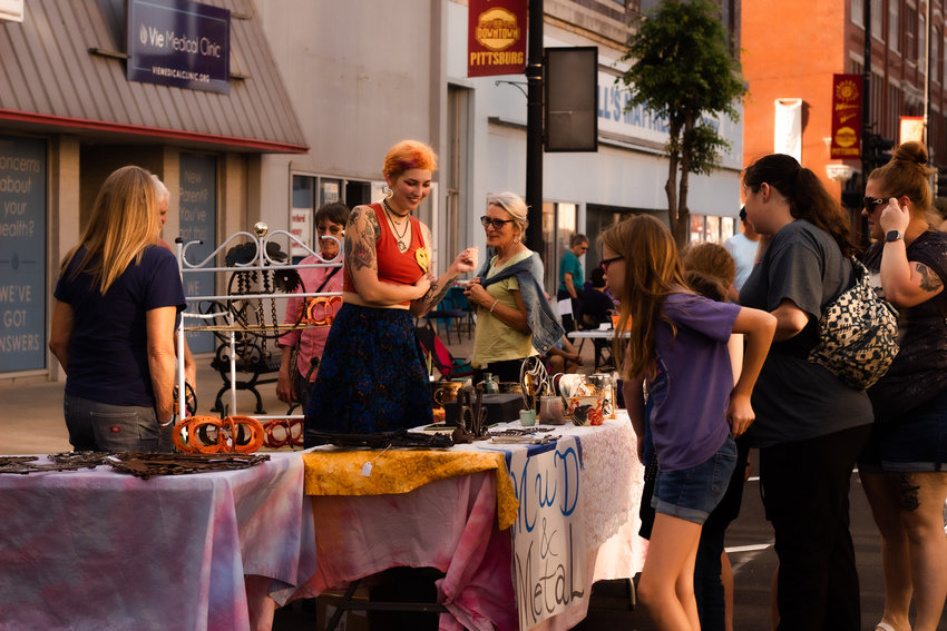 Sylvia Grotheer of Mud &amp; Metal shows her work to ArtWalk attendees on Friday, Sept. 23.