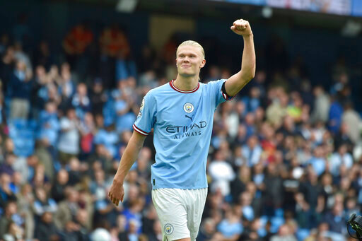 Manchester City's Erling Haaland celebrates at the end of the English Premier League soccer match between Manchester City and Manchester United at Etihad stadium in Manchester, England, Sunday, Oct. 2, 2022. Manchester City won 6-3 and he scored an hat trick. (AP Photo/Rui Vieira)