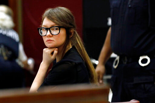 FILE &mdash; Anna Sorokin sits at the defense table during jury deliberations in her trial at New York State Supreme Court, April 25, 2019, in New York. Sorokin, whose exploits inspired a Netflix series, has been released from immigration custody into home confinement, a spokesperson said Saturday, Oct. 8, 2022.  (AP Photo/Richard Drew, File)