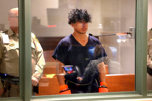 Las Vegas Strip stabbing spree suspect Yoni Barrios makes his initial court appearance at the Regional Justice Center in Las Vegas, Friday, Oct. 7, 2022. Barrios will be charged with murder, the region's top prosecutor said Friday. (K.M. Cannon/Las Vegas Review-Journal via AP)
