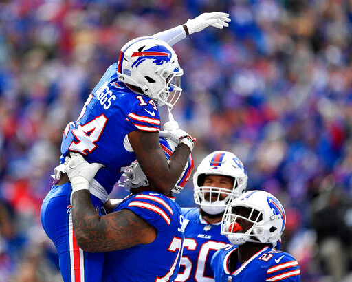 Buffalo Bills wide receiver Stefon Diggs (14) celebrates after scoring on a pass from quarterback Josh Allen during the first half of an NFL football game against the Pittsburgh Steelers in Orchard Park, N.Y., Sunday, Oct. 9, 2022. (AP Photo/Adrian Kraus)